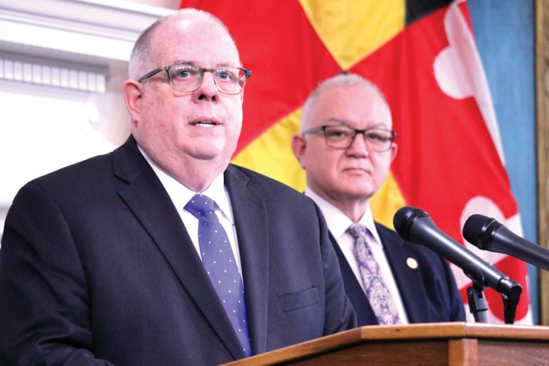 Gov. Larry Hogan outlines his proposed $47.9 billion budget plan for the state of Maryland for the next fiscal year during a news conference in Annapolis, Maryland, on Tuesday, Jan. 14, 2020. Hogan highlighted funds to fight crime, improve education and protect the Chesapeake Bay. David Brinkley, Hogan's budget chief, is standing right. (AP Photo/Brian Witte)